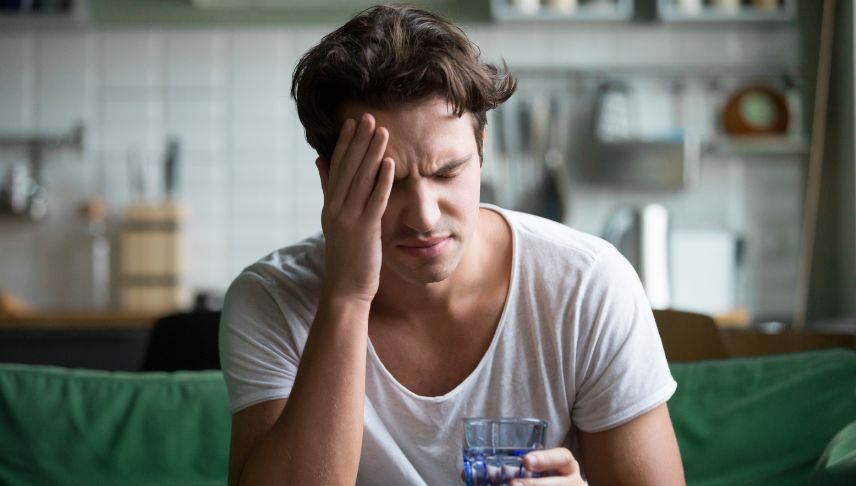 man suffering from headache after an accident