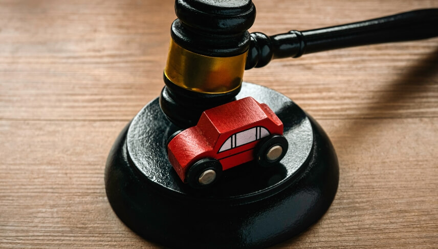 gavel with car on top of it