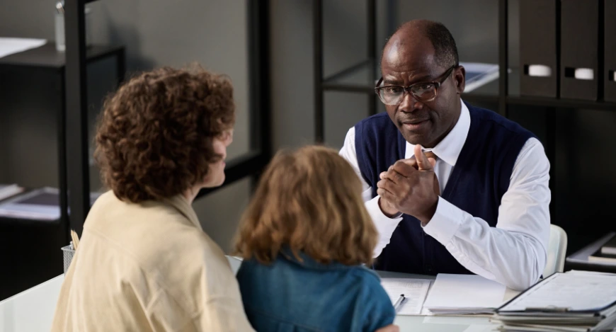 a professional talking to a mother and child