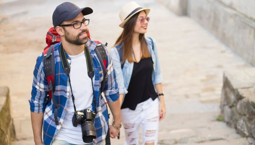 tourist couple holding hands